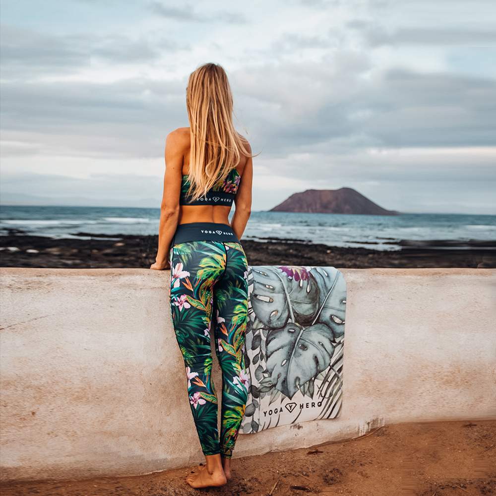 Girl in jungle leggings watching the ocean